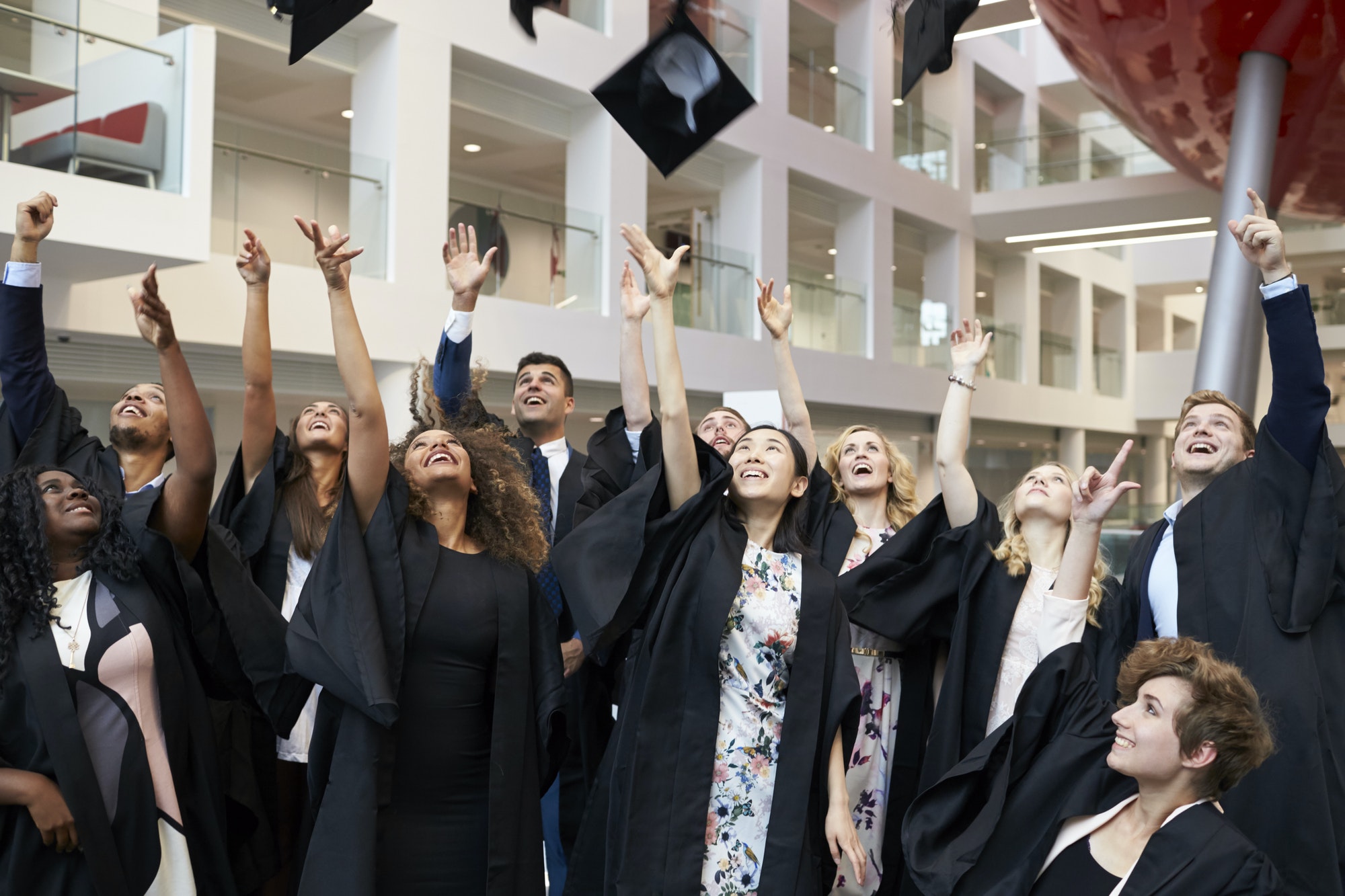 university-students-throwing-their-caps-in-the-air-on-graduation-day.jpg